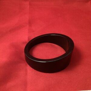 Asymetric black plastic bangle